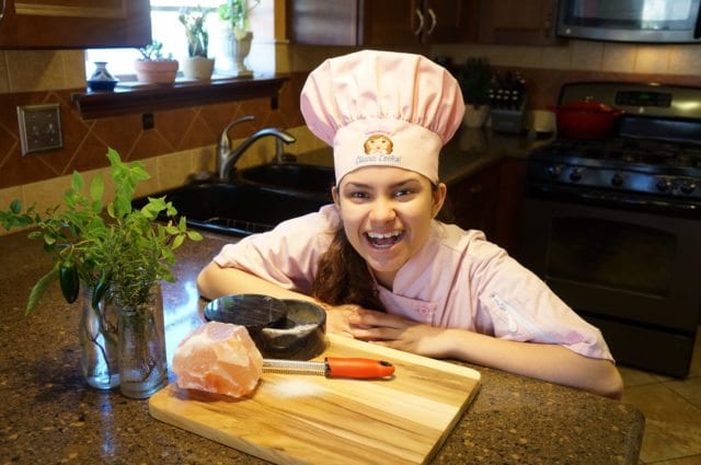 Kid Chef Eliana with Pink Himalayan Salt Rock and Herbs from her Garden 2016